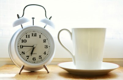 Alarm clock and cup of coffee
